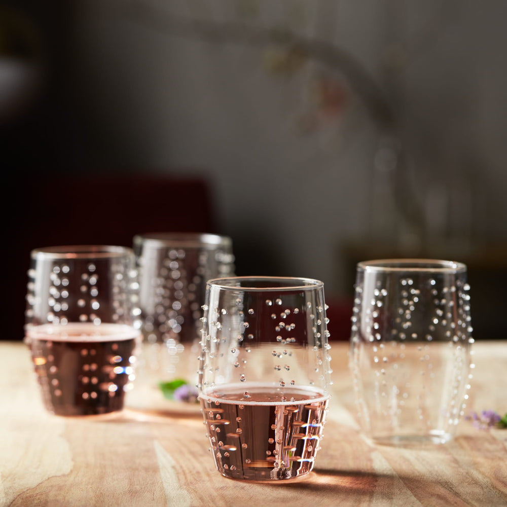 Clear glass with sea-inspired texturing is ideal for serving ice tea, chilled water, soft drinks, and craft beer