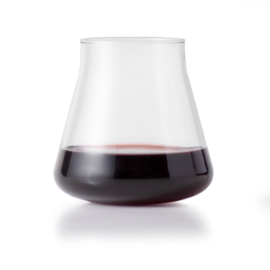 Elevate your tabletop with the striking silhouette of Magnitude stemless glassware, featuring a versatile, angular, tulip-shaped bowl for wine, cocktails, water, or soft drinks