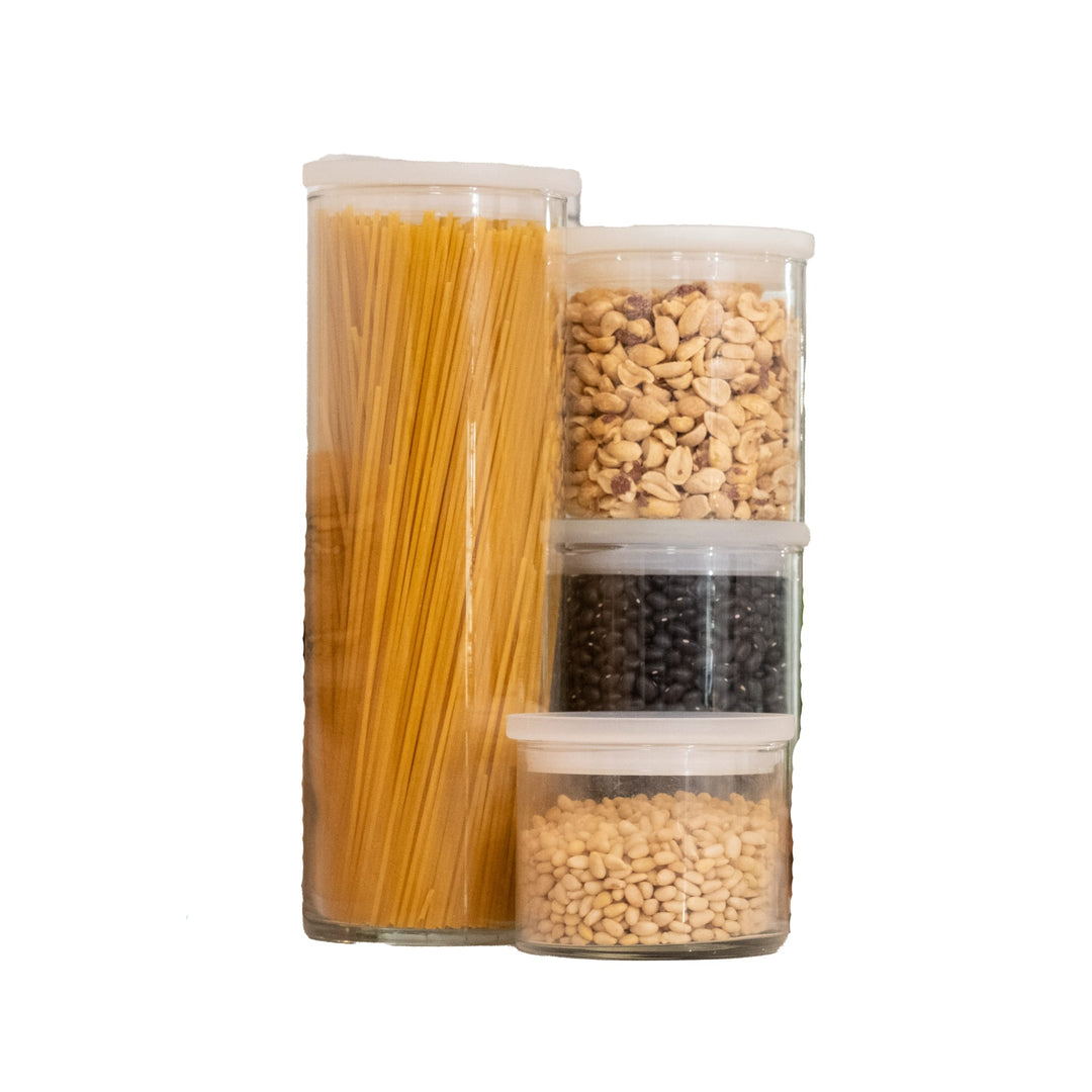 Glass stacking cylinder jars can be used to store dry goods in the kitchen or pantry or for organization around the house