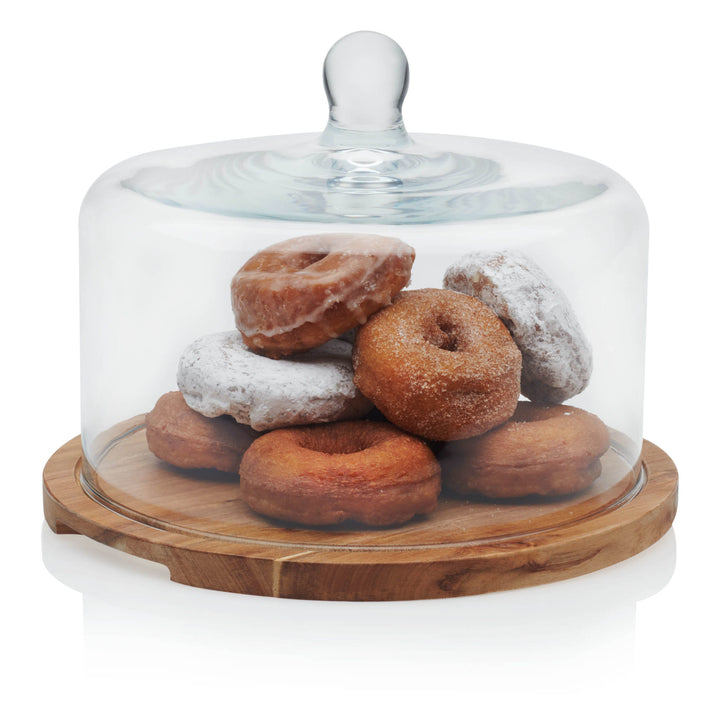 Gorgeous Acacia wood serving board with show-stopping glass dome brings warm, natural sophistication to any decor; great for entertaining and gifting