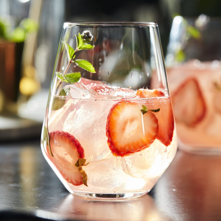 Stemless profile with a stable base provides comfort in hand and helps reduce spills.