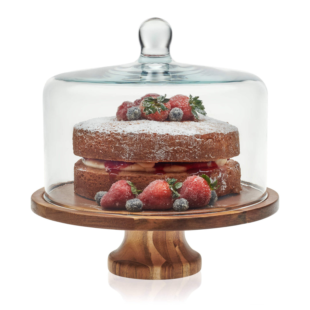 Gorgeous Acacia wood serving board with show-stopping glass dome brings warm, natural sophistication to any decor; great for entertaining and gifting