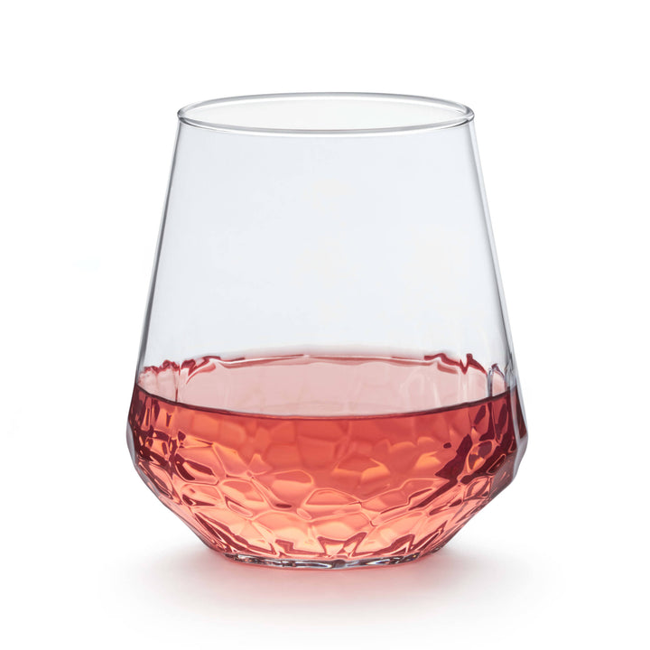 Hammered design creates a mesmerizing reflection when light shines through the stemless wine glass